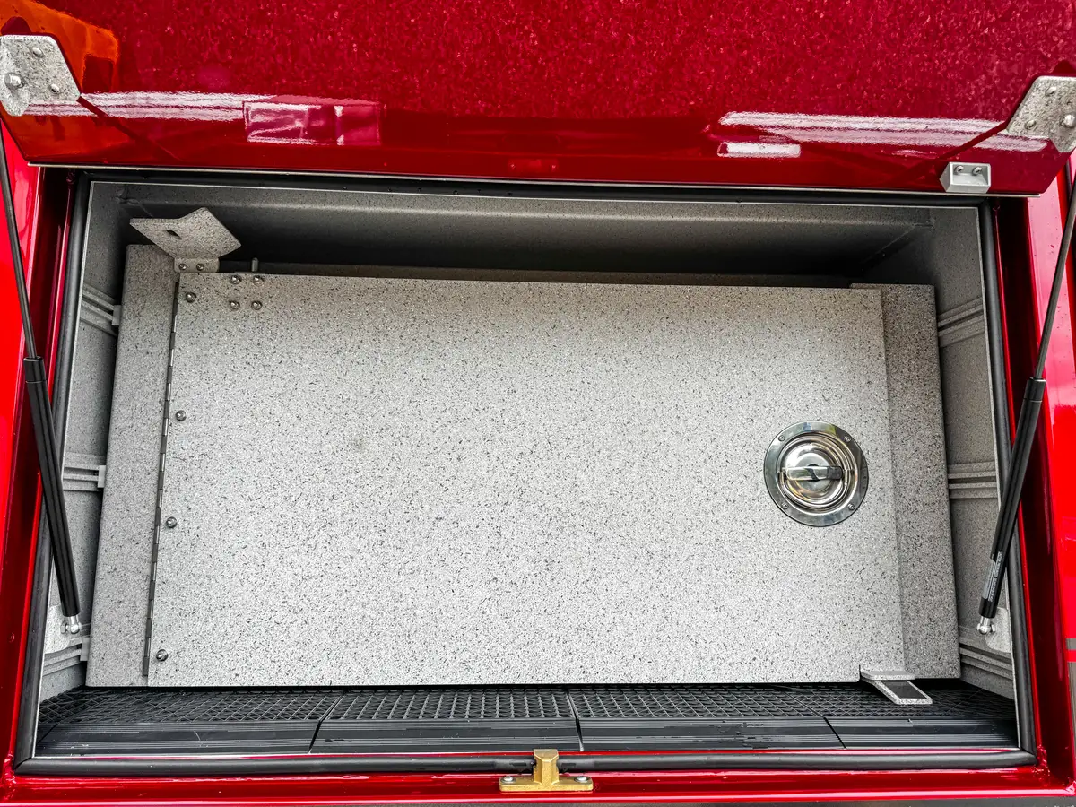 Rear corner compartment open view with interior bay and door hinges.